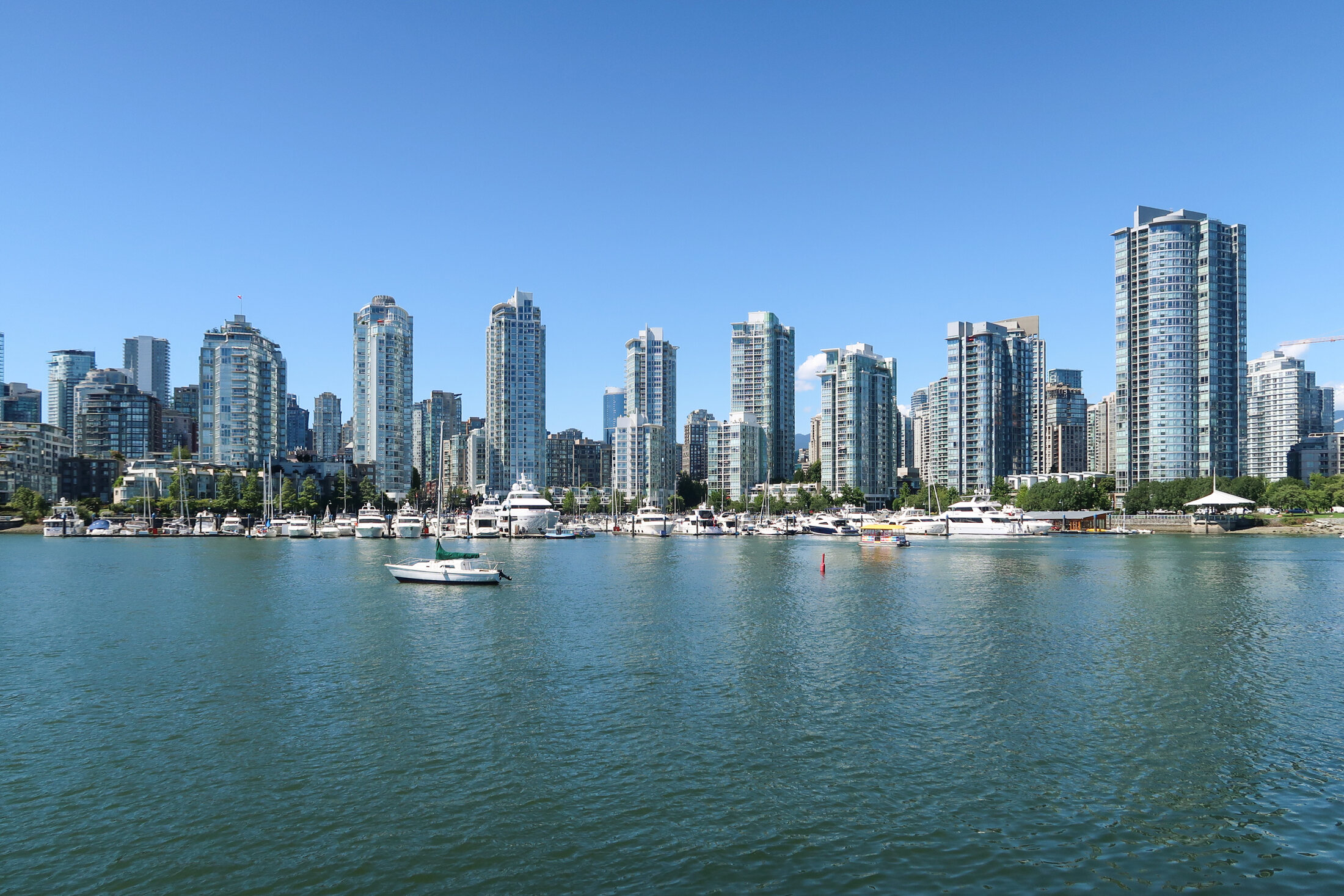 Vancouver waterfront towers and a marina viewed across Coal Harbour